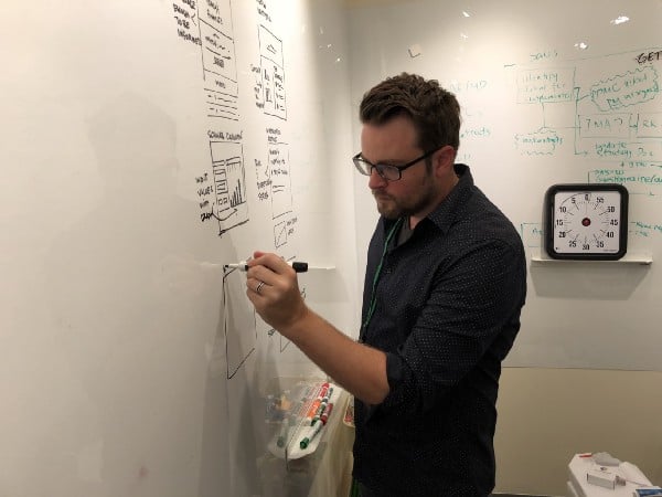 An example artifact of a Design Sprint Lightning Demo exercise next to a Voltage Control designer, Ben Faubion.